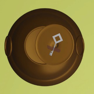 脱出ゲーム「庵」茶釜の裏にある銀色の鍵のズーム画像